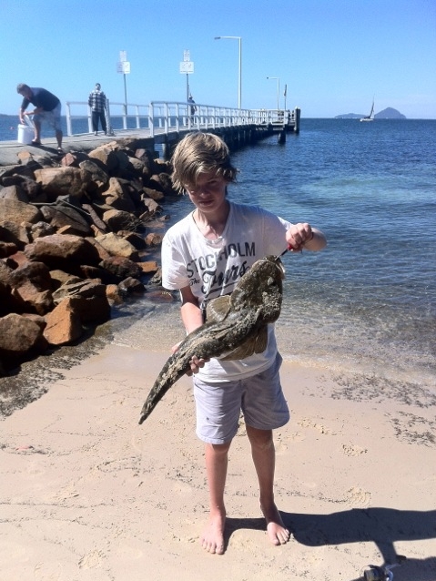 Young fisho Sean Vasquez with his unlucky flathead caught and released at Port Stephens, NSW.